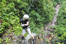 a person ready to rappel down the lost canyon